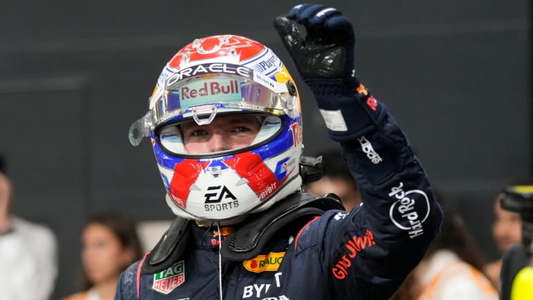 Red Bull driver Max Verstappen of the Netherlands celebrates after...