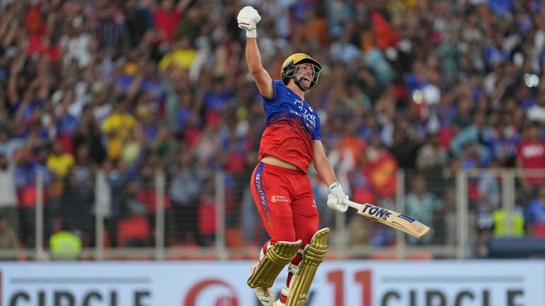 Royal Challengers Bengaluru's Will Jacks celebrates his century during the...