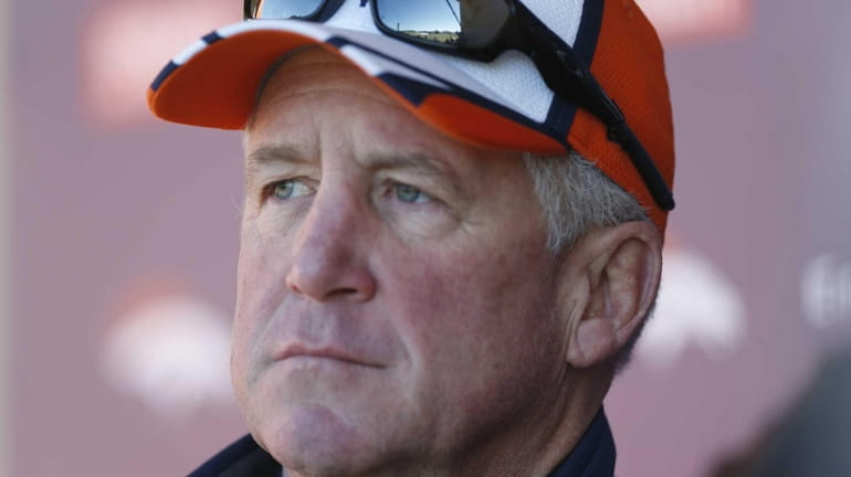 Denver Broncos head coach John Fox considers a question from...