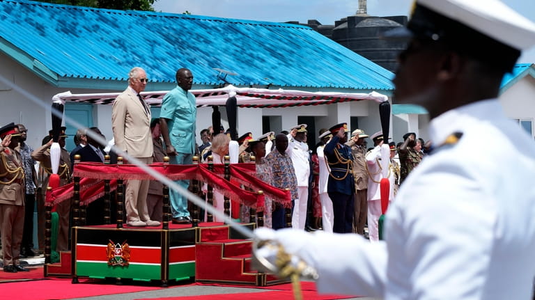 Britain's King Charles III, on podium left, and Kenya's President...