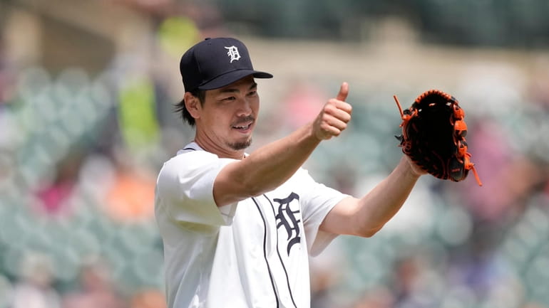 Detroit Tigers starting pitcher Kenta Maeda points to first baseman...