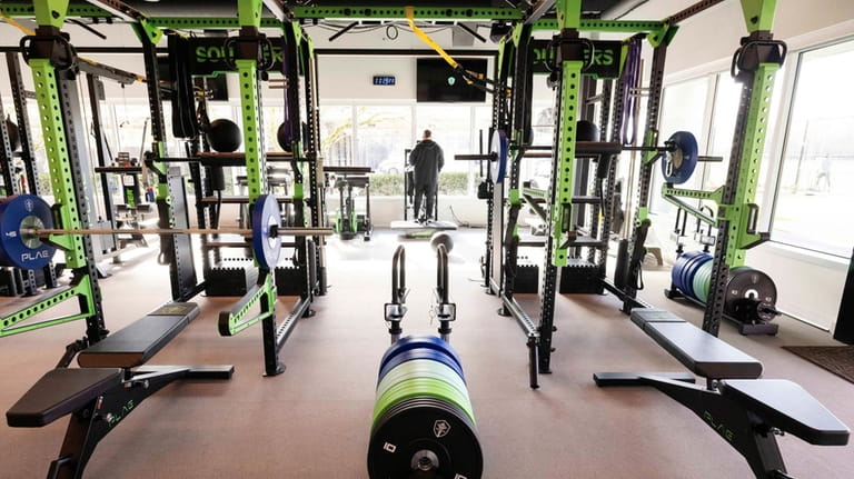 The weight room is seen during a media tour of...