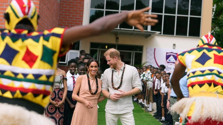Prince Harry and Meghan visit children at the Lights Academy...