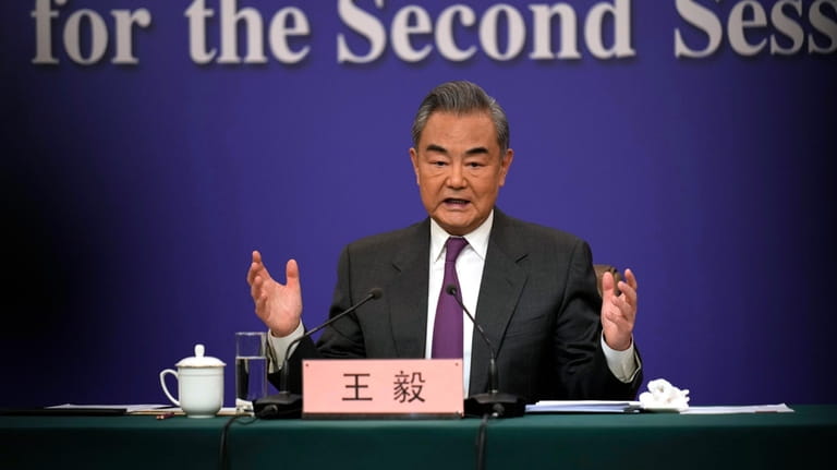 Chinese Foreign Minister Wang Yi speaks during a press conference...