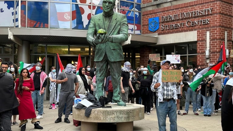 Antiwar protesters rally at DePaul University in Chicago, Thursday evening, after...