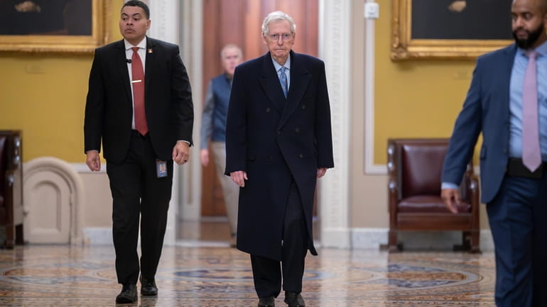 Senate Minority Leader Mitch McConnell (R-Ky.), center, arrives at the Capitol...