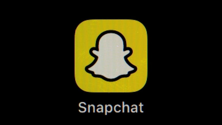 The icon for instant messaging app Snapchat is seen on...