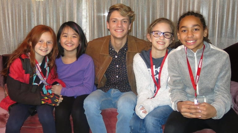 "Henry Danger" star Jace Norman, center, with Kidsday reporters Hailey Groth,...