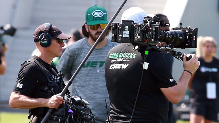A camera crew from “Hard Knocks” documents Jets training camp...