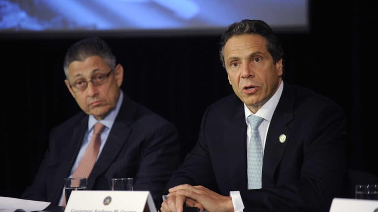 Gov. Andrew Cuomo, right, speaks at a news conference with...