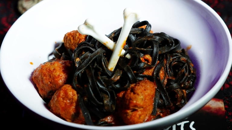 Witches Hair Pasta is squid-ink pasta with meatballs at "Nightmare...