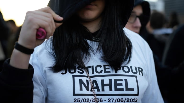A protestor wears a t-shirt reading "Justice for Nahel" during...