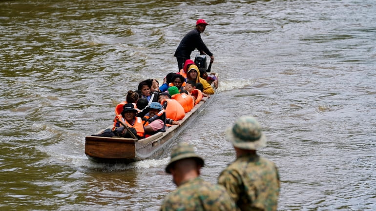 Migrants heading north arrive to Lajas Blancas where a Panamanian...