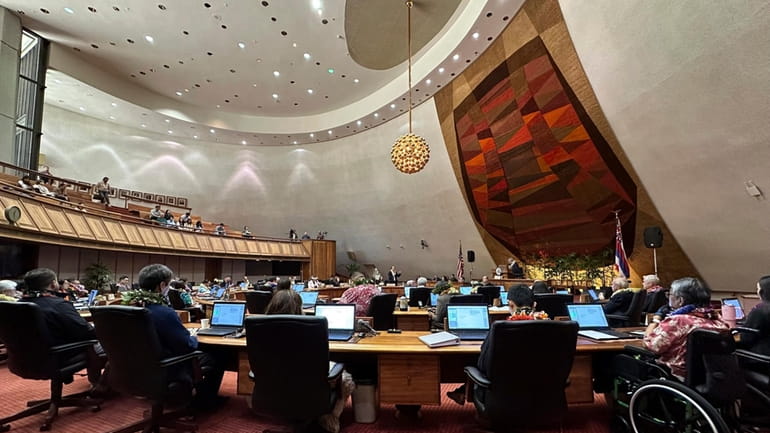 Lawmakers deliberate in the Hawaii House of Representatives at the...