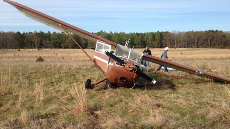 A 1947 Stinson fixed-wing aircraft landed on its wing off...
