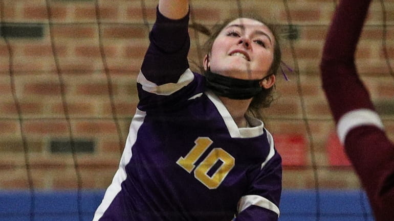 Morgan Reese of Sayville goes for the kill during the...