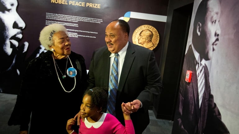 Martin Luther King III, right, the son of Rev. Martin...