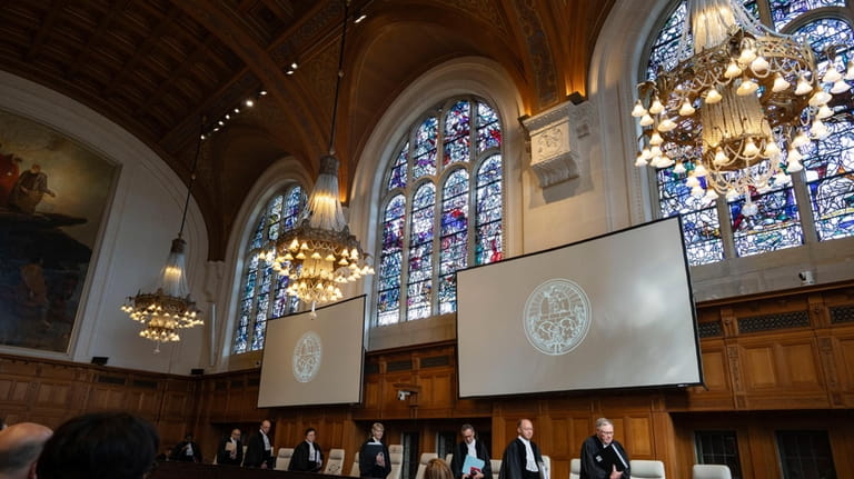 All rise as judges enter the International Court of Justice,...