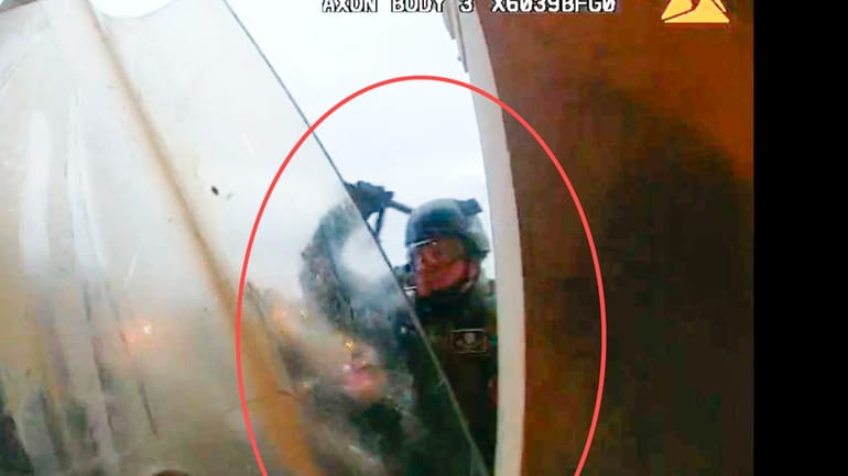 This image from police body-worn camera video, contained and annotated...