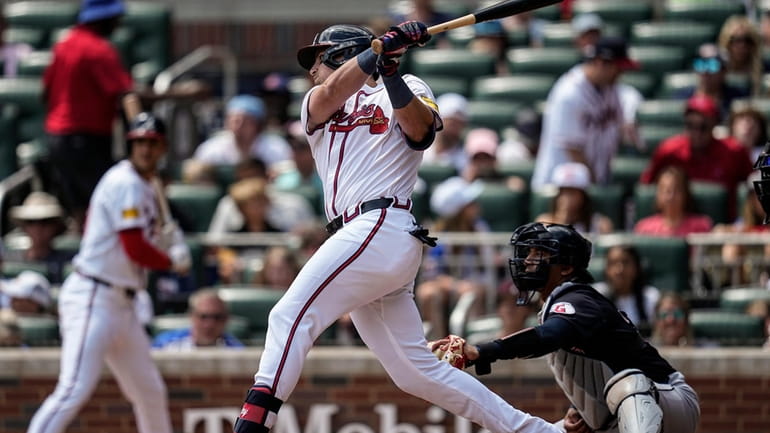 Atlanta Braves third baseman Austin Riley (27) hits a single...