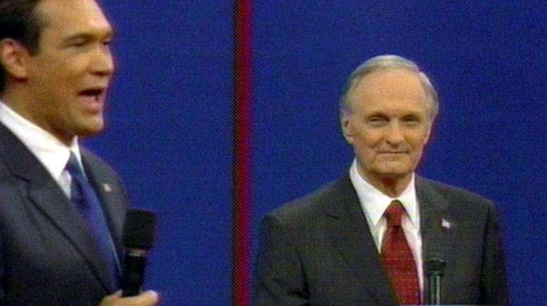 Jimmy Smits, left,  debates  Alan Alda on "The West Wing."