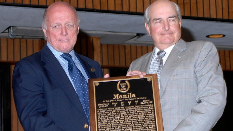 Manila's trainer, LeRoy Jolley, left, presents a Hall of Fame...