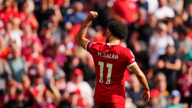 Liverpool's Mohamed Salah celebrates scoring his side's opening goal during...