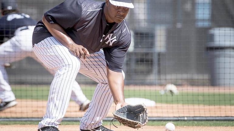New York Yankees first baseman Chris Carter takes part in...
