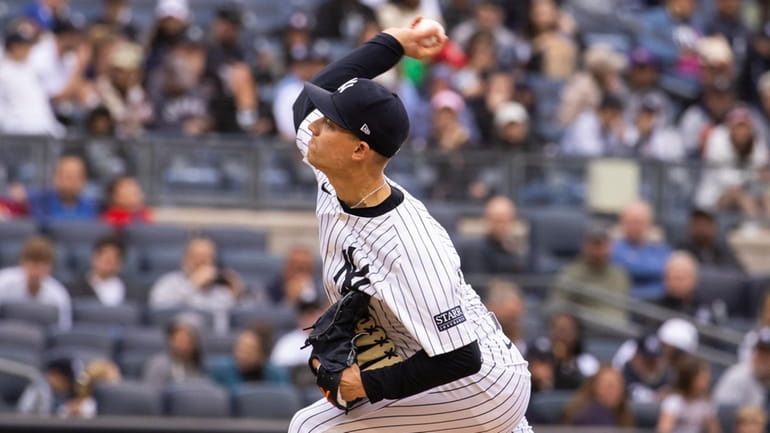 Yankees pitcher Luke Weaver throws in the seventh inning against...