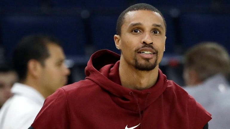 The Cavaliers' George Hill prepares to shoot during a practice...