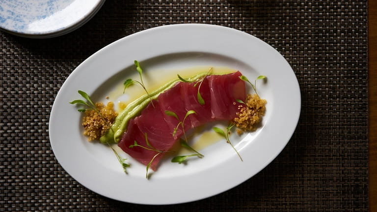 Yellowfin tuna crudo with wasabi avocado mousse, smoked sesame seeds,...