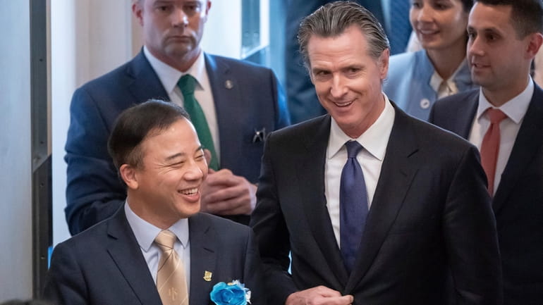 Visiting California Gov. Gavin Newsom, right, and President and Vice-Chancellor...