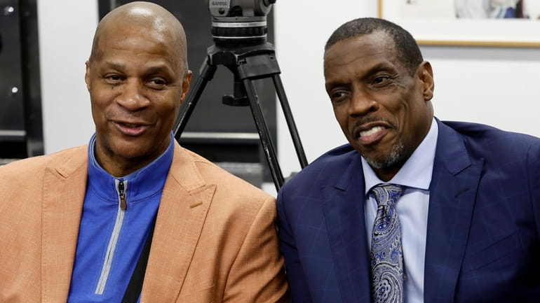 Darryl Strawberry, left, and Dwight Gooden look on in the...