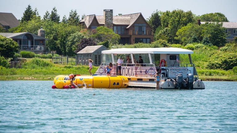 A water trampoline by MTK Cruises in Lake Montauk in...