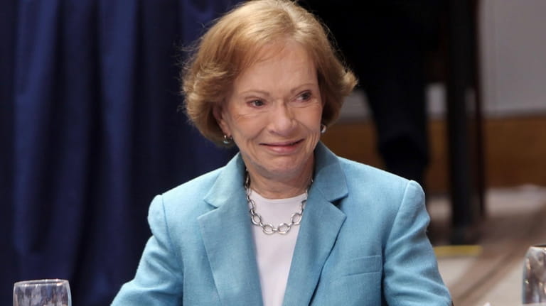Former First Lady Rosalynn Carter listens to a speaker at...