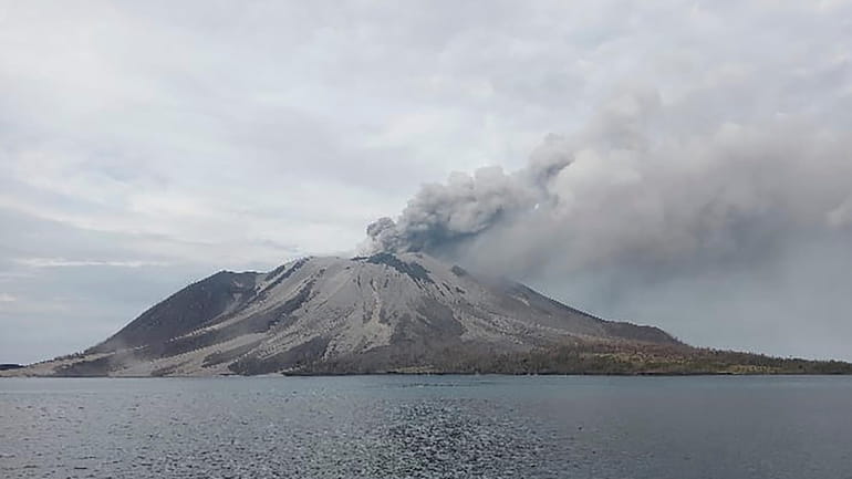 Mount Ruang volcano is seen during the eruption from Tagulandang...