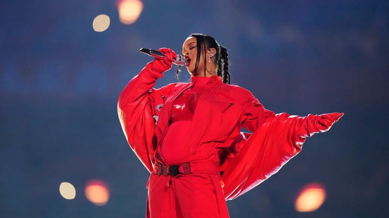 Rihanna, who is expecting her second child, performs during the halftime...