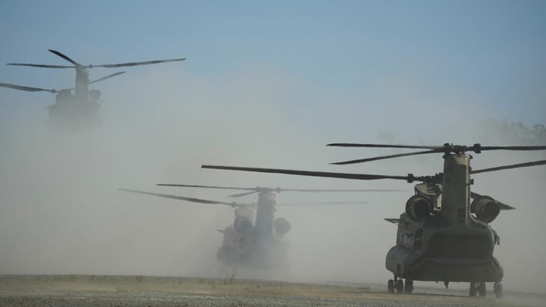U.S. Army CH-47s takes off at Paredes Air Station at...