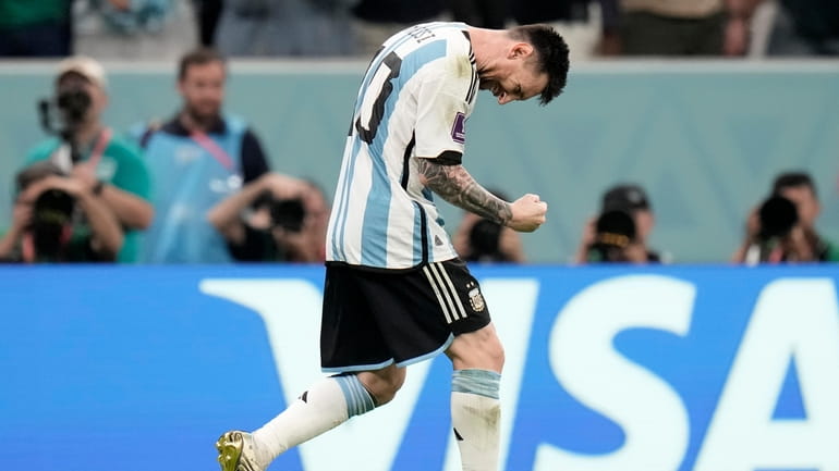 Argentina's Lionel Messi celebrates after scoring the opening goal during...