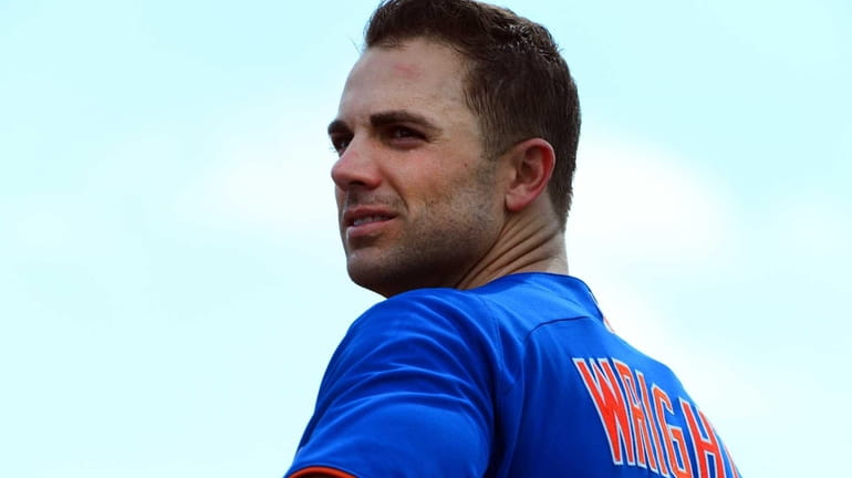 Mets third baseman David Wright looks on during a spring...