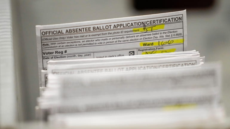 Absentee ballots are seen during a count at the Wisconsin...