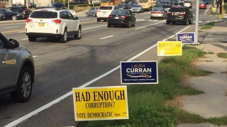 Democratic campaign signs lined Jericho Turnpike Thursday evening, Oct. 5,...