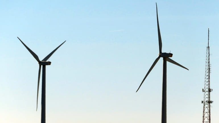Land-based wind turbines spin in Atlantic City. N.J., on Nov....