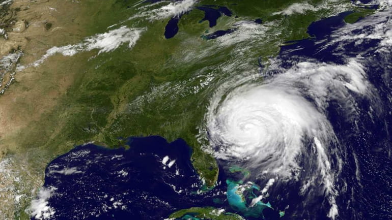 This NASA/NOAA GOES Project image shows Hurricane Irene moving up...