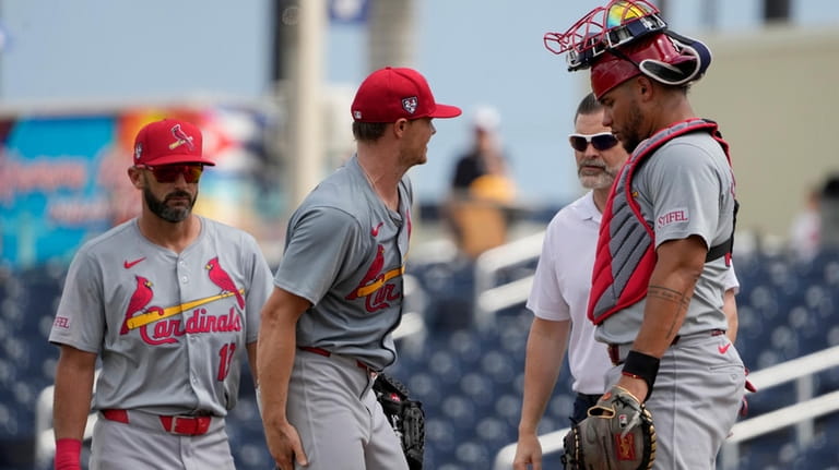 St. Louis Cardinals starting pitcher Sonny Gray, second from left,...