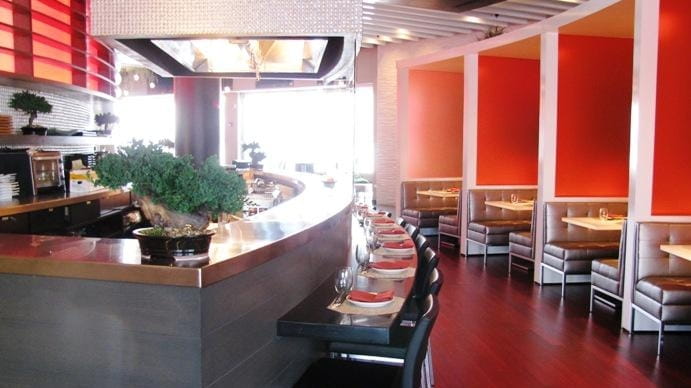 The sushi-yakitori bar at Two Steak & Sushi Den in...