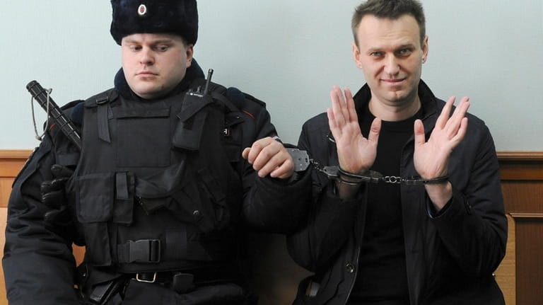 Russian opposition leader Alexei Navalny, right, poses for press as...