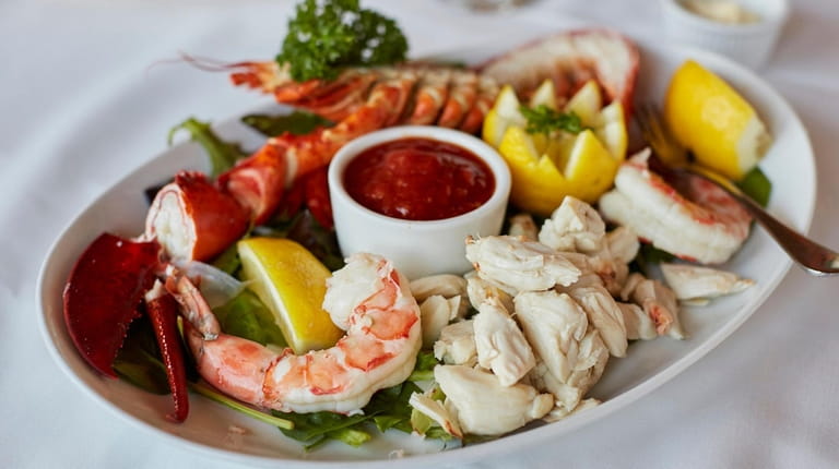 The cold seafood plate with lobster, crab and shrimp at...