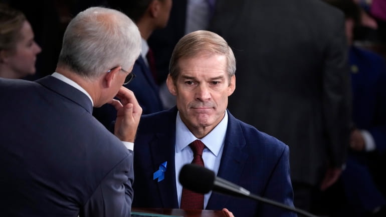 Rep. Jim Jordan (R-Ohio), right, consults Wednesday with Rep. Patrick...