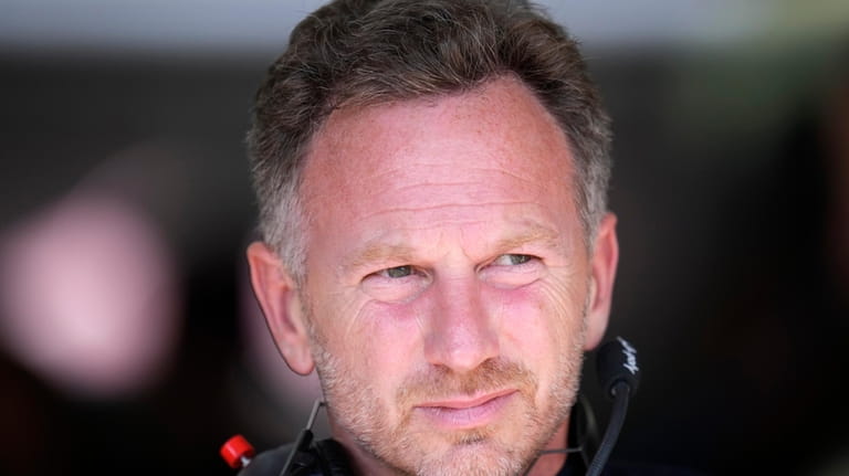 Red Bull racing team principal Christian Horner stands at pit...